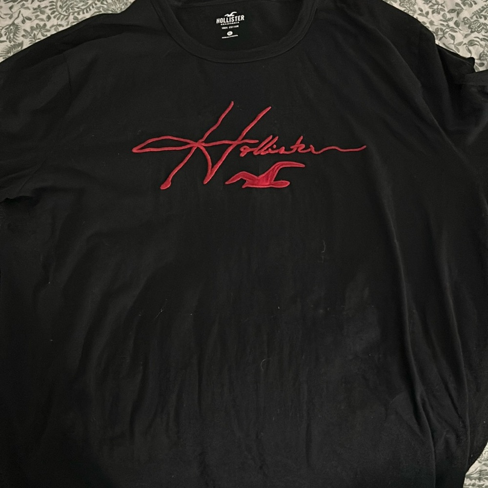 black hollister long sleeve, with red on arm and front!
